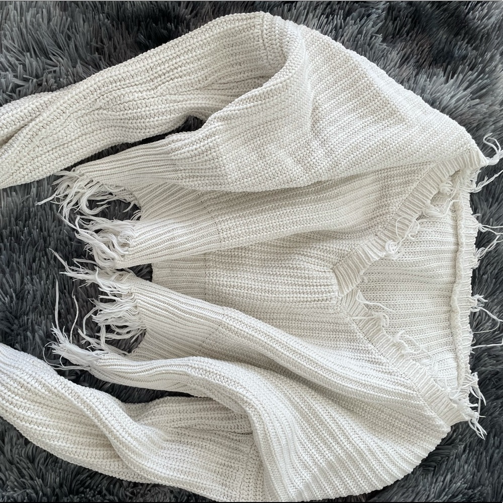 oversized distressed white sweater with fringe detailing super warm and trendy